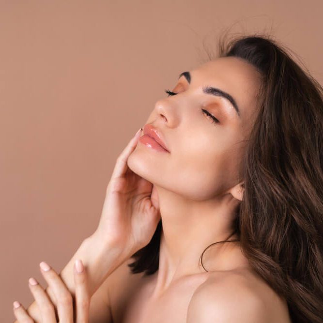 Closeup beauty portrait of a topless woman with perfect skin and natural makeup